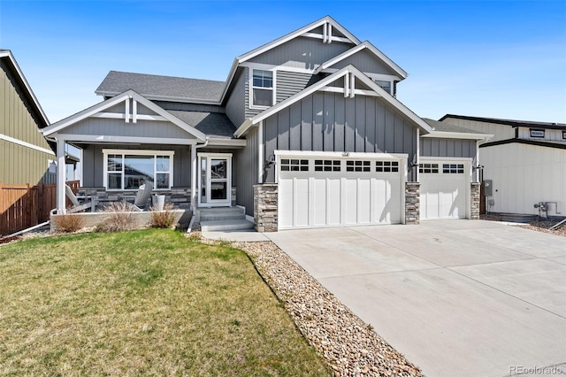 208 Dorothy Dr, Berthoud, CO 80513 - craftsman-style house with driveway, board and batten siding, stone siding, a front lawn, and a garage