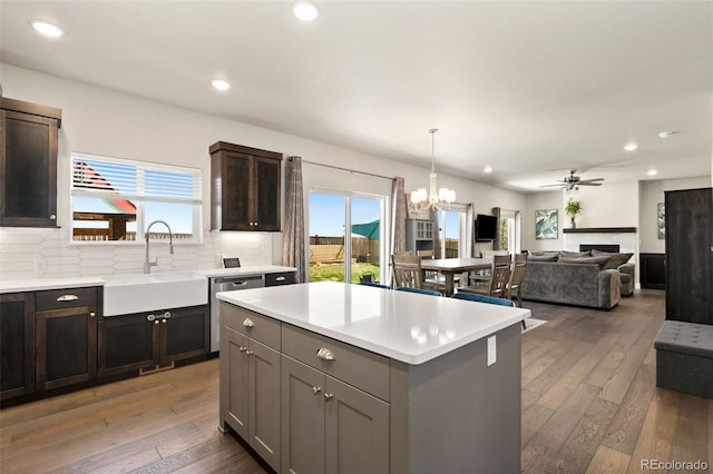 208 Dorothy Dr, Berthoud, CO 80513 - kitchen featuring dishwasher, light countertops, a sink, and light wood-style flooring