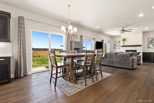208 Dorothy Dr, Berthoud, CO 80513 - dining room featuring dark wood-type flooring, a fireplace, and recessed lighting