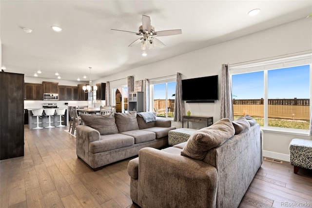 208 Dorothy Dr, Berthoud, CO 80513 - living area with dark wood-style flooring, a wealth of natural light, and recessed lighting