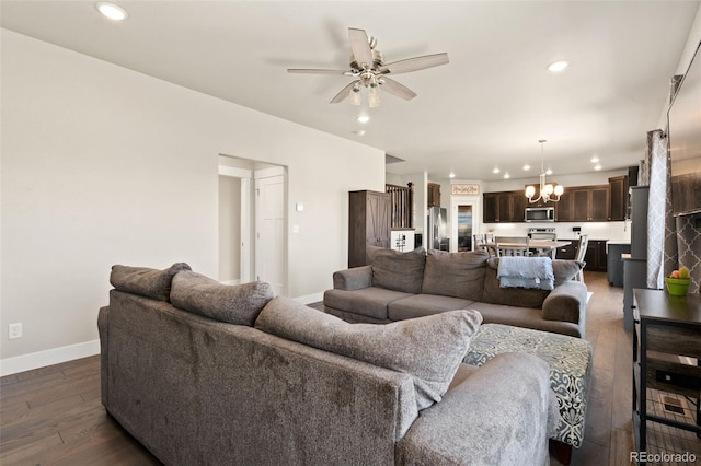 208 Dorothy Dr, Berthoud, CO 80513 - living room featuring baseboards, hardwood / wood-style flooring, recessed lighting, ceiling fan with notable chandelier, and beverage cooler