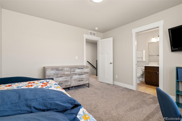 208 Dorothy Dr, Berthoud, CO 80513 - carpeted bedroom featuring visible vents, baseboards, and connected bathroom