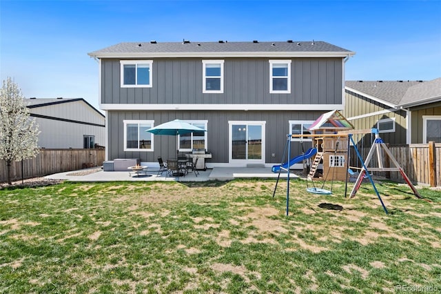 208 Dorothy Dr, Berthoud, CO 80513 - rear view of property with a patio, a fenced backyard, a playground, and a yard