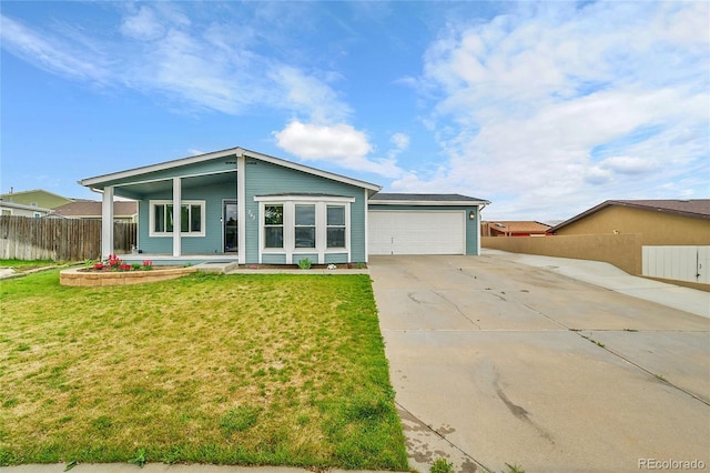 243 Cherokee Ct, Brighton, CO 80603 - view of front of house featuring driveway, a garage, and a porch