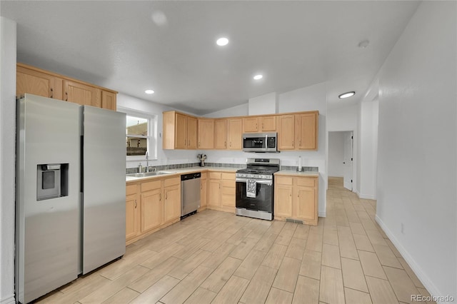 243 Cherokee Ct, Brighton, CO 80603 - kitchen with stainless steel appliances, light brown cabinets, a sink, light countertops, and recessed lighting