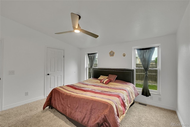 243 Cherokee Ct, Brighton, CO 80603 - carpeted bedroom featuring vaulted ceiling, baseboards, and a ceiling fan