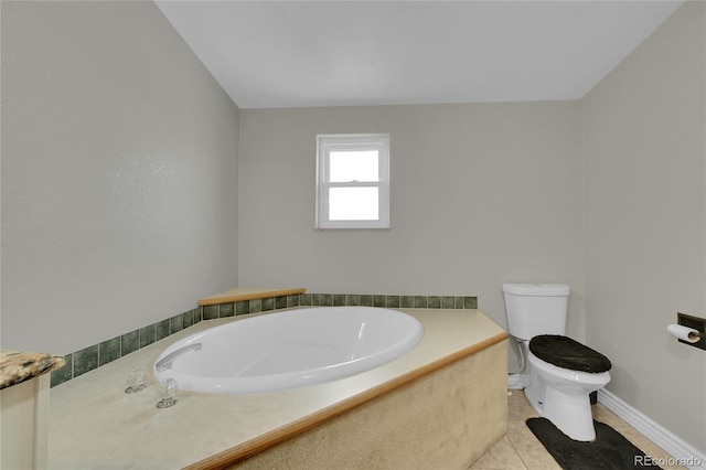 243 Cherokee Ct, Brighton, CO 80603 - full bathroom with a bath, toilet, tile patterned floors, and baseboards