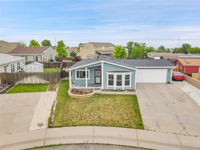 243 Cherokee Ct, Brighton, CO 80603 - view of front of home with a residential view, concrete driveway, and an attached garage