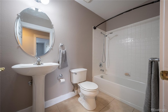 full bath with baseboards, bathing tub / shower combination, toilet, and tile patterned floors