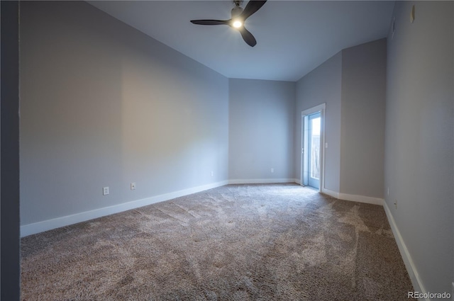 empty room featuring carpet floors, baseboards, and a ceiling fan