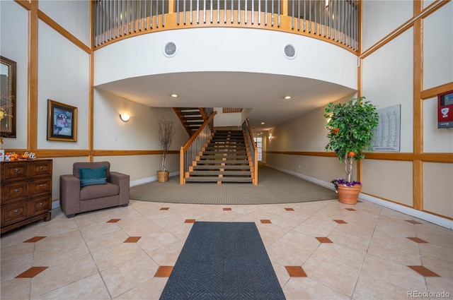 lobby featuring visible vents and stairs