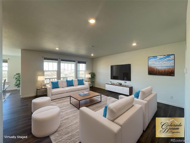 living room featuring plenty of natural light, dark wood-style flooring, and recessed lighting