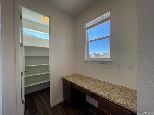 office with visible vents and dark wood finished floors