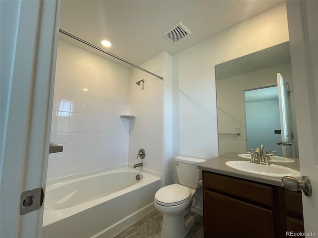 bathroom featuring toilet, shower / bathtub combination, visible vents, and vanity