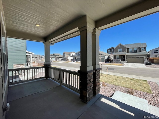 view of patio / terrace featuring a residential view and covered porch