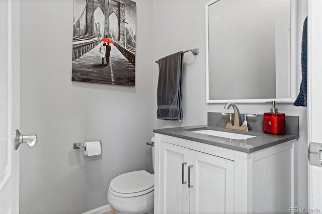 5301 Clovervale Cir, Highlands Ranch, CO 80130 - bathroom with vanity, toilet, and baseboards