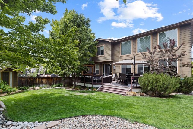 5301 Clovervale Cir, Highlands Ranch, CO 80130 - rear view of house with a wooden deck
