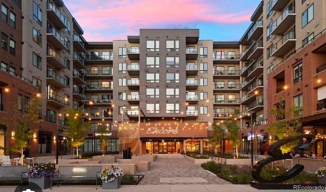 view of outdoor building at dusk