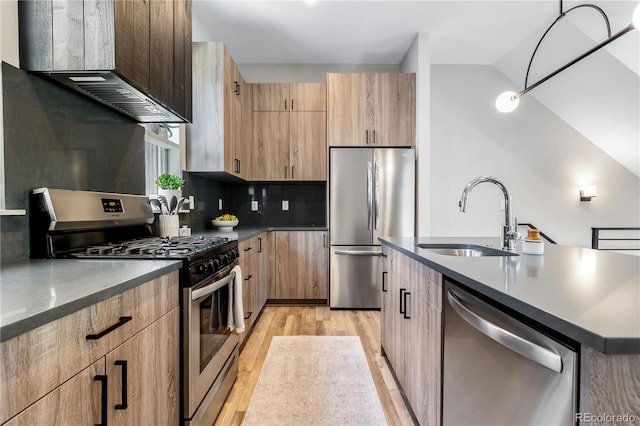 kitchen with stainless steel appliances, tasteful backsplash, sink, a center island with sink, and custom range hood