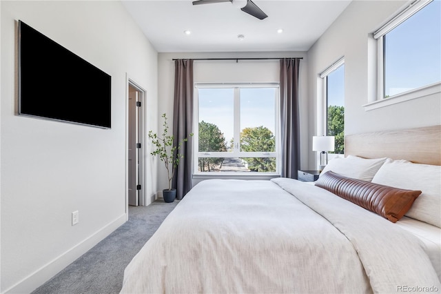 bedroom featuring ceiling fan and light colored carpet