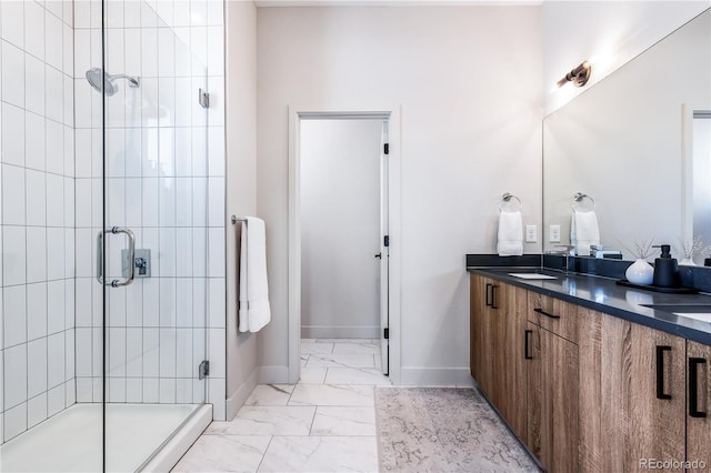 bathroom with walk in shower and vanity