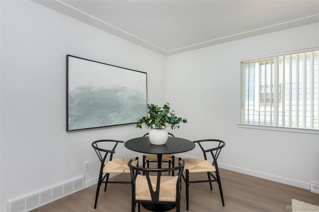 dining room with hardwood / wood-style floors