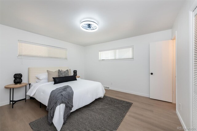 bedroom with light wood-type flooring