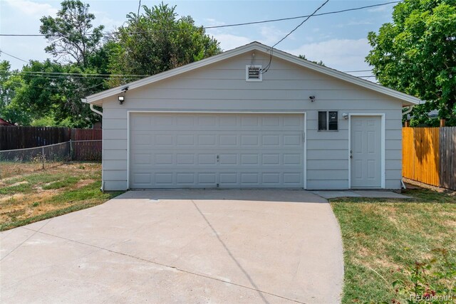 garage featuring a yard