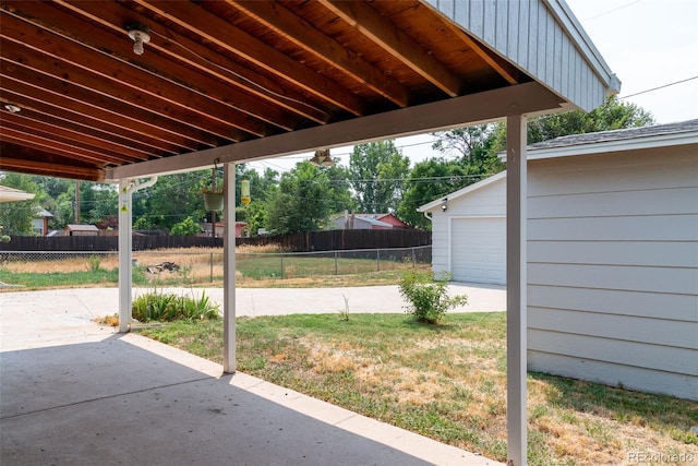 view of patio / terrace featuring a garage and an outdoor structure