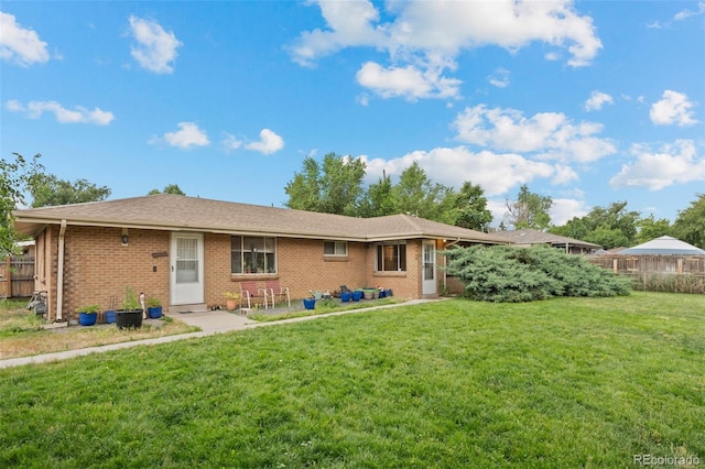 4785 Carr St, Wheat Ridge, CO 80033 - rear view of house featuring brick siding