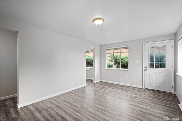 4785 Carr St, Wheat Ridge, CO 80033 - spare room featuring wood finished floors and baseboards