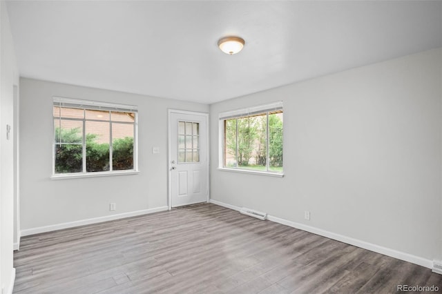 4785 Carr St, Wheat Ridge, CO 80033 - unfurnished room with wood finished floors and plenty of natural light