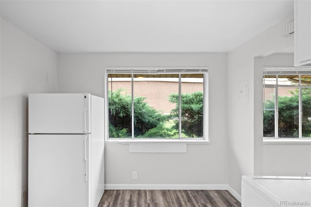 4785 Carr St, Wheat Ridge, CO 80033 - unfurnished dining area featuring plenty of natural light and wood finished floors