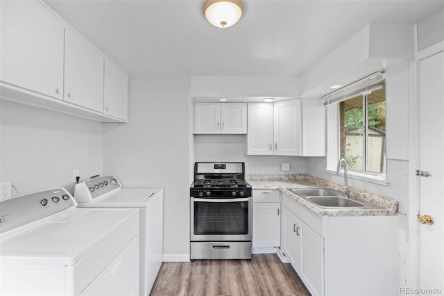 4785 Carr St, Wheat Ridge, CO 80033 - laundry area with independent washer and dryer and light wood-type flooring