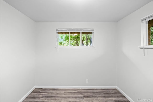 4785 Carr St, Wheat Ridge, CO 80033 - empty room with healthy amount of natural light and dark wood-type flooring