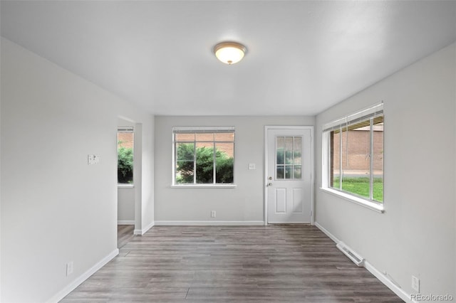 4785 Carr St, Wheat Ridge, CO 80033 - spare room featuring healthy amount of natural light and wood finished floors