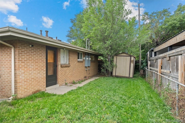 4785 Carr St, Wheat Ridge, CO 80033 - fenced backyard featuring a shed