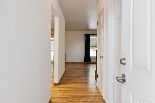 hall with light wood-type flooring