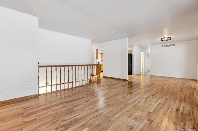 unfurnished room featuring light wood-type flooring