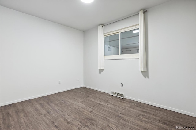 empty room featuring dark hardwood / wood-style floors