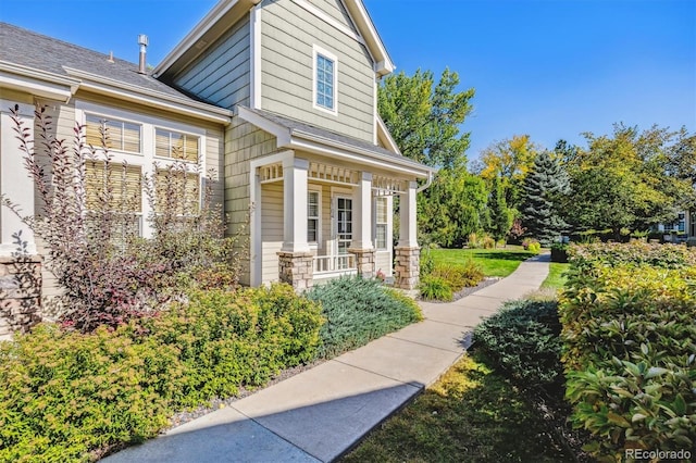 view of property exterior with a porch