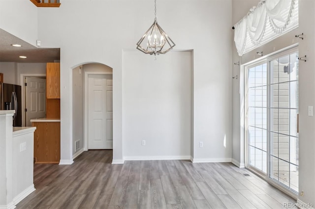 unfurnished dining area with light wood-type flooring