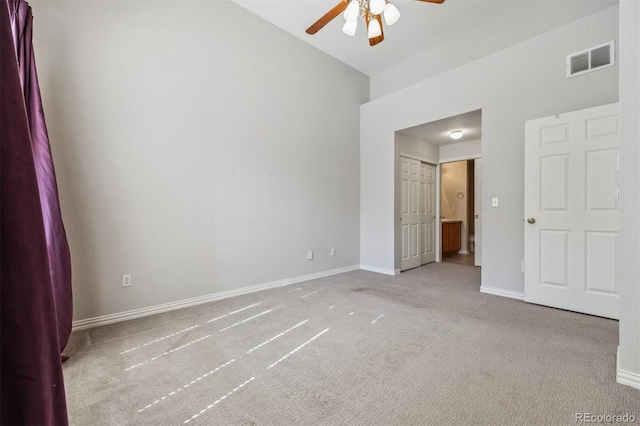 unfurnished bedroom with ceiling fan and light colored carpet