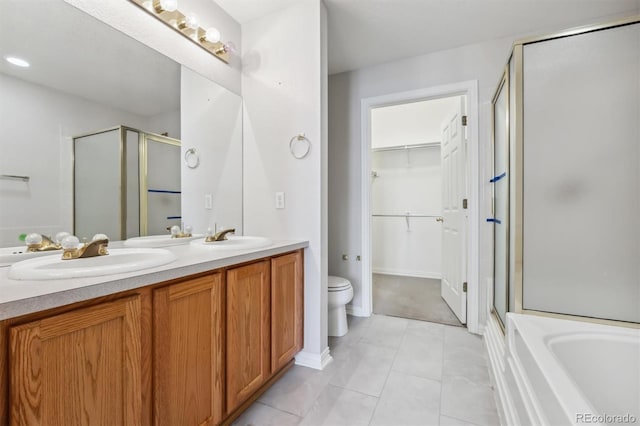 full bathroom with toilet, vanity, separate shower and tub, and tile patterned floors