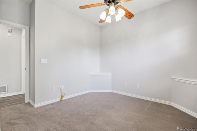 carpeted empty room with ceiling fan