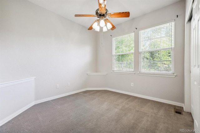 unfurnished room with carpet and ceiling fan