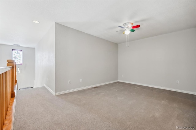 carpeted empty room with ceiling fan