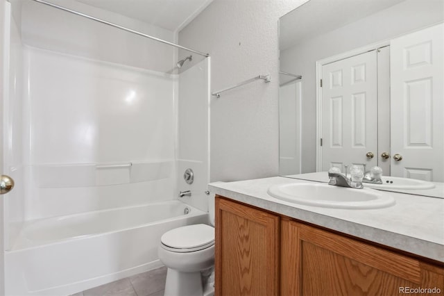 full bathroom featuring tile patterned floors, washtub / shower combination, vanity, and toilet