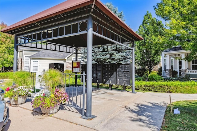 view of parking / parking lot with a mail area