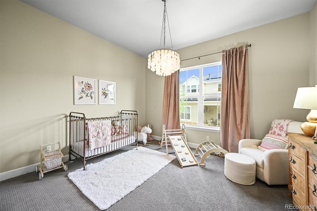 15033 Delhi Ave, Parker, CO 80134 - carpeted bedroom with a chandelier, baseboards, and a nursery area